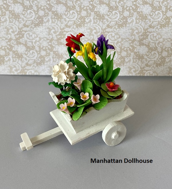 Miniature Flower Arrangement in a White Wheelbarrow - Click Image to Close
